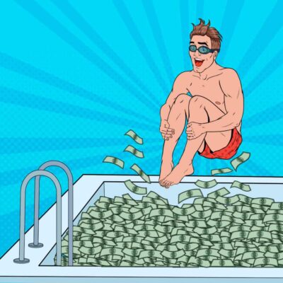 Happy man jumps in money